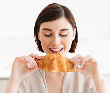 Woman eating bread